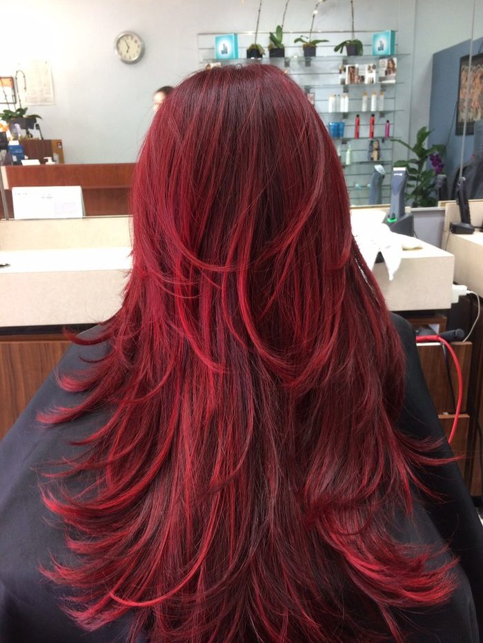 Long hair colored a deep red.