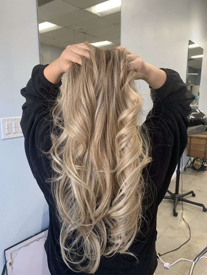 Grey and silver tones blended through mid-length hair.